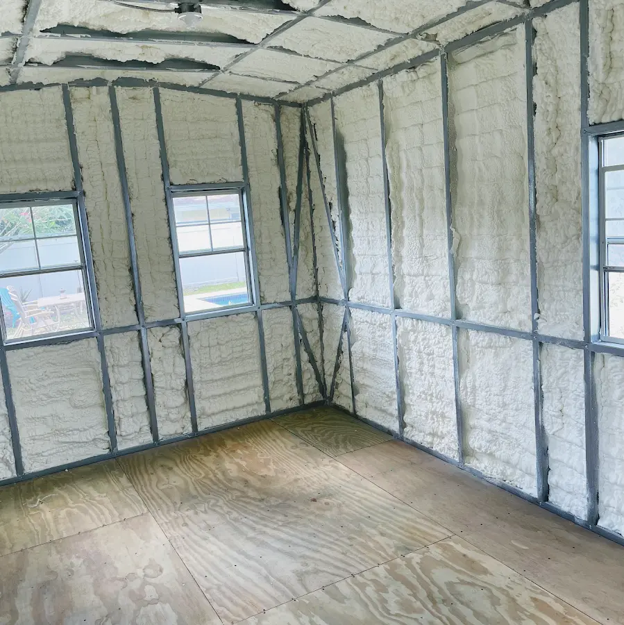 Closed-cell spray foam insulation applied to wall cavities in a residential project in Kingsland